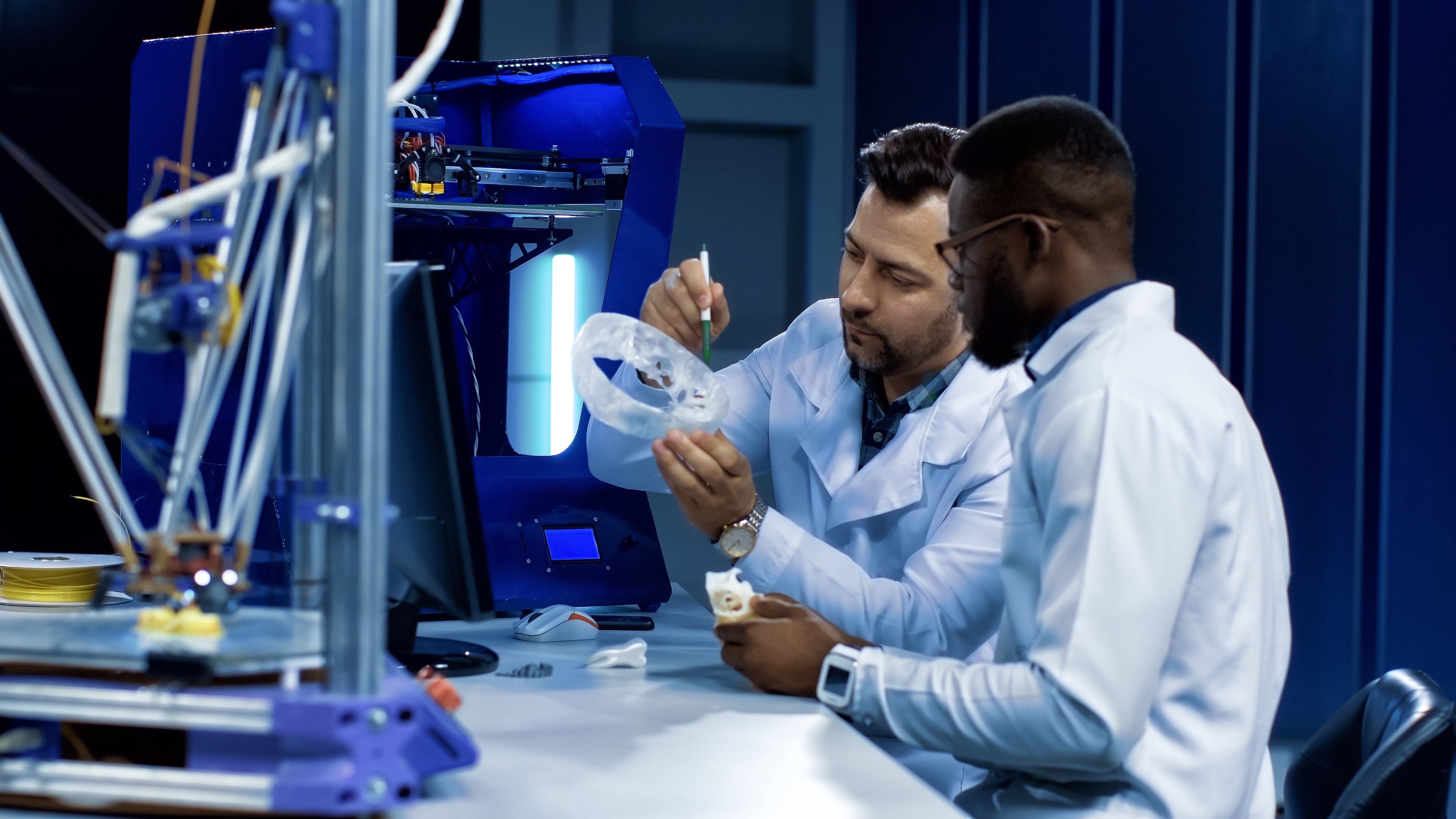 Two doctors in a medical lab work on medical invention