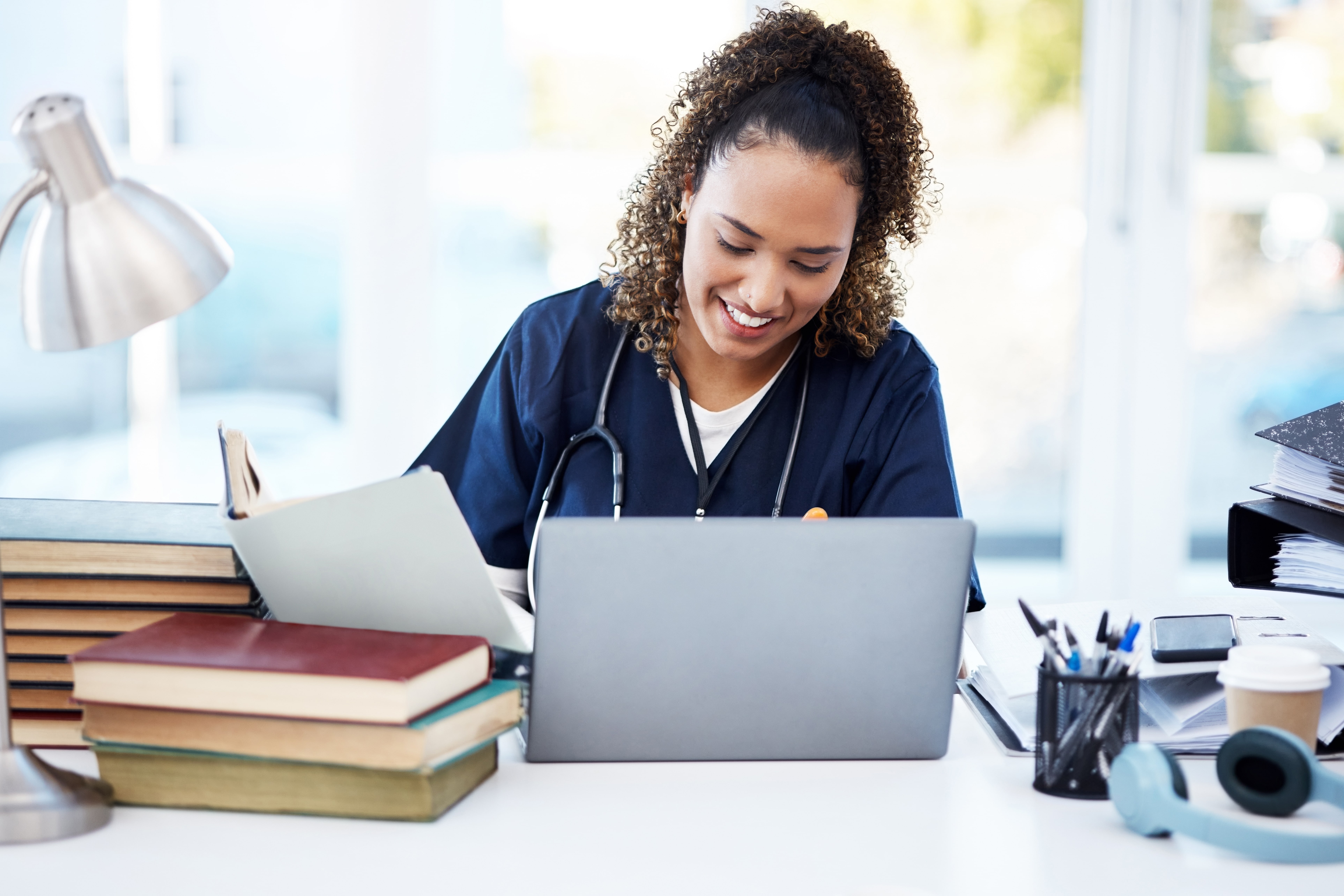 Woman studying at her laptop for the ABA BASIC exam